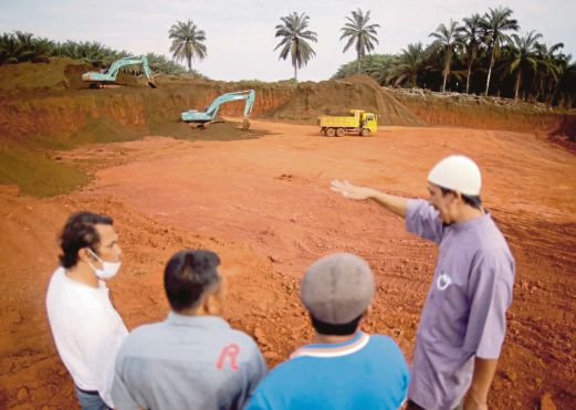  A villager showing the bauxite mining area in Felda Bukit Goh near Kuantan. Embracing sustainability is no longer an option for the mining industry.