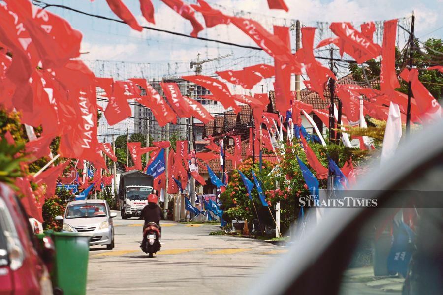Party flags add a carnival air to the Portuguese settlement in Melaka yesterday. -NSTP/SYAFEEQ AHMAD