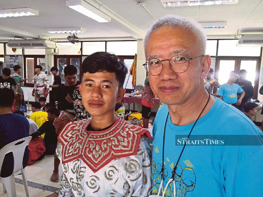 Somchai (left) is grateful to Thai senator Datuk Anusart Suwanmongkol for helping disadvantaged youths like himself.