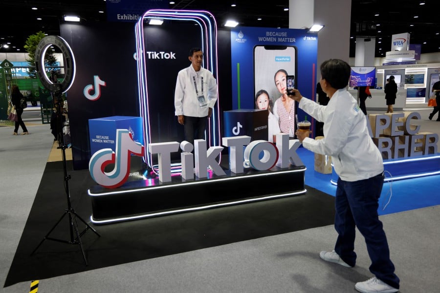 A man posing at the TikTok booth during the Asia-Pacific Economic Cooperation summit in Bangkok, Thailand, last year. AFP PIC