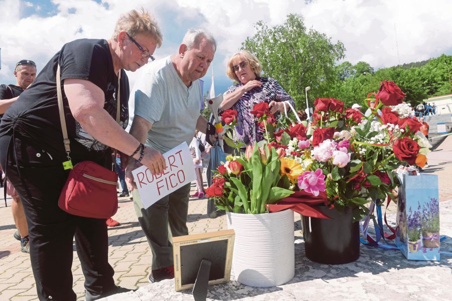  Supporters of Slovakian Prime Minister Robert Fico placing flowers in front of FD Roosevelt University Hospital in Banska Bystrica, Slovakia, on Saturday. Fico is being treated at this hospital. -AFP PIC 