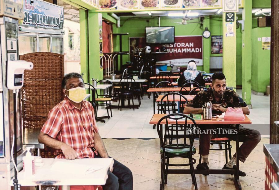 A restaurant in Kuala Lumpur yesterday — the first day dining was allowed for fully vaccinated people.- NSTP/HAZREEN MOHAMAD