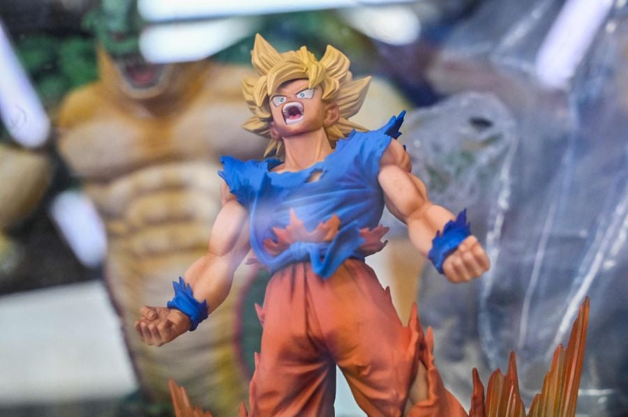 A figurine character from the popular "Dragon Ball" manga franchise sits for sale inside a glass case at a shop in downtown Tokyo on March 8, 2024. AFP FILE PIC