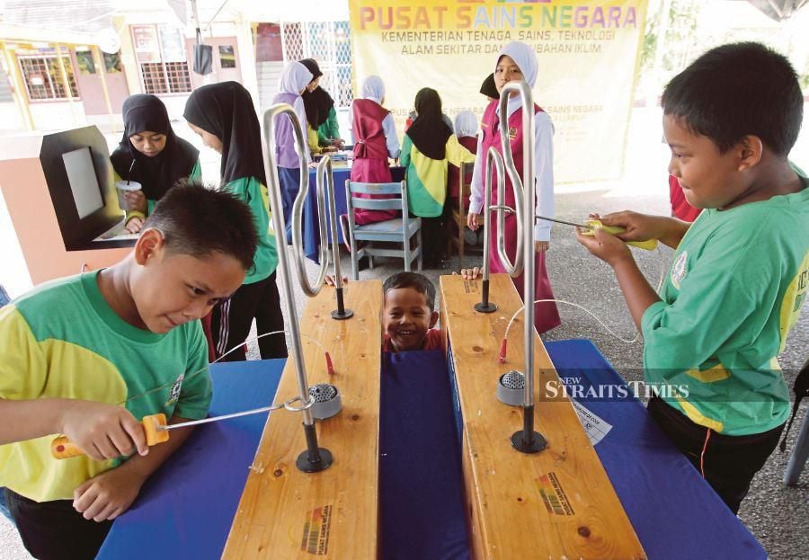  Pupils checking out some exhibits at a science, technology, engineering and mathematics promotion roadshow in Alor Star in 2019. FILE PIC