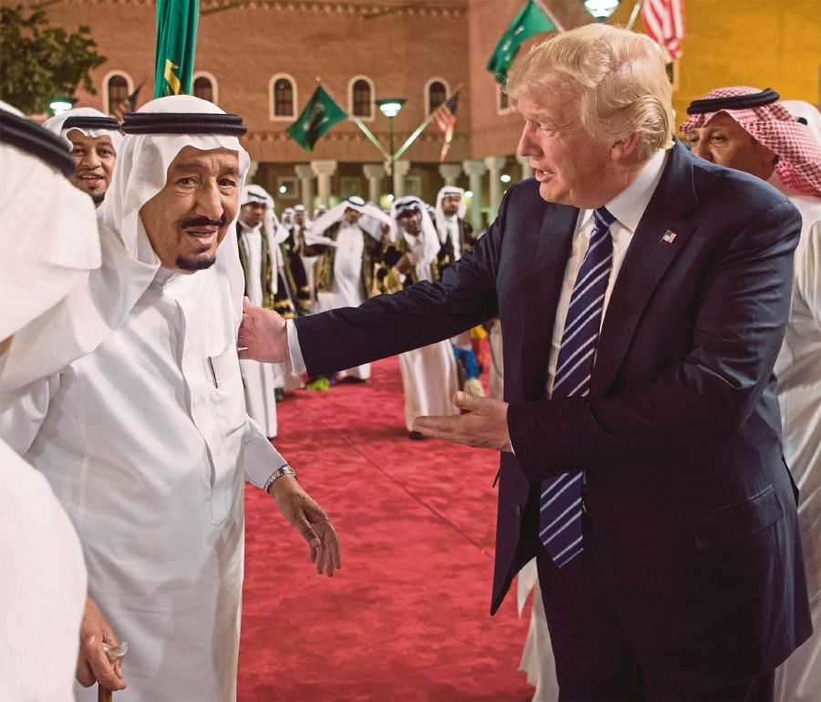 United States President Donald Trump and Saudi Arabia’s King Salman Abdulaziz al-Saud arriving for a reception ahead of a banquet at Murabba Palace in Riyadh on Saturday. Geopolitics, foreign policy and defence priorities feature strongly in the agenda of Trump’s first foreign trip. AFP PIC