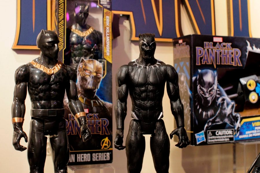 Black Panther toys are displayed to attendees at the Hasbro showroom during the annual New York Toy Fair, on Feb 20, 2018, in New York. Panther claws, masks and action figures are leaping off store shelves after runaway hit "Black Panther" -- the first film in the Marvel universe focused on a black superhero -- shredded box office expectations with a massive opening weekend. Toy tie-ins remain a crucial profit driver for movie studios, even if each merchandise opportunity is not massively successful, experts say. (AFP PHOTO / EDUARDO MUNOZ ALVAREZ)