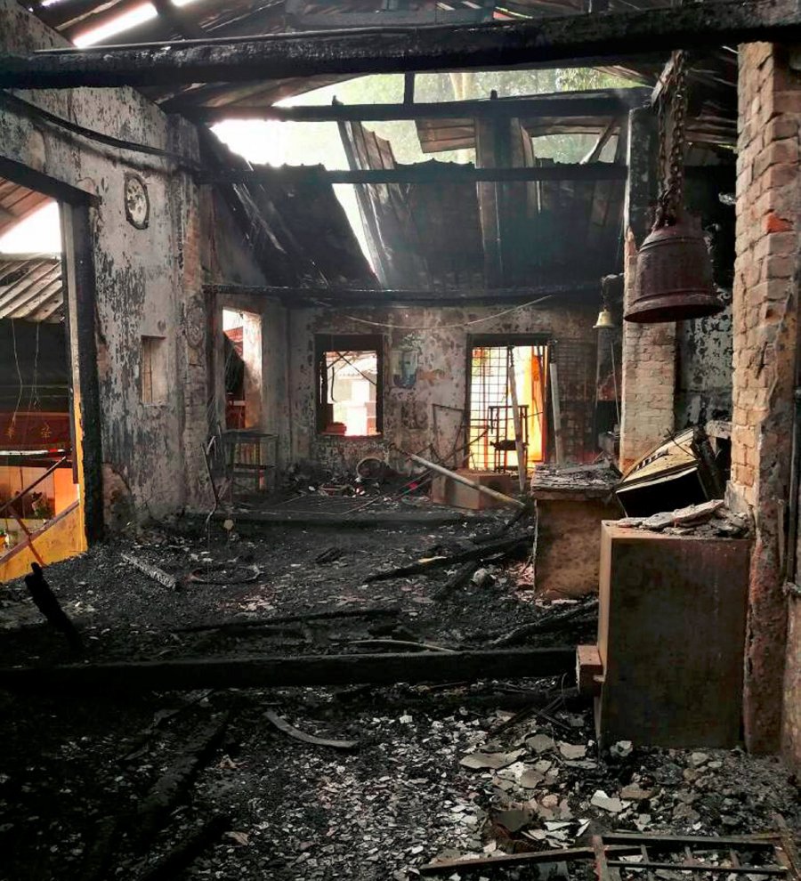 The charred Then Sze Temple which was destroyed in a fire. Pic by KHAIRUL NAJIB ASARULAH KHAN