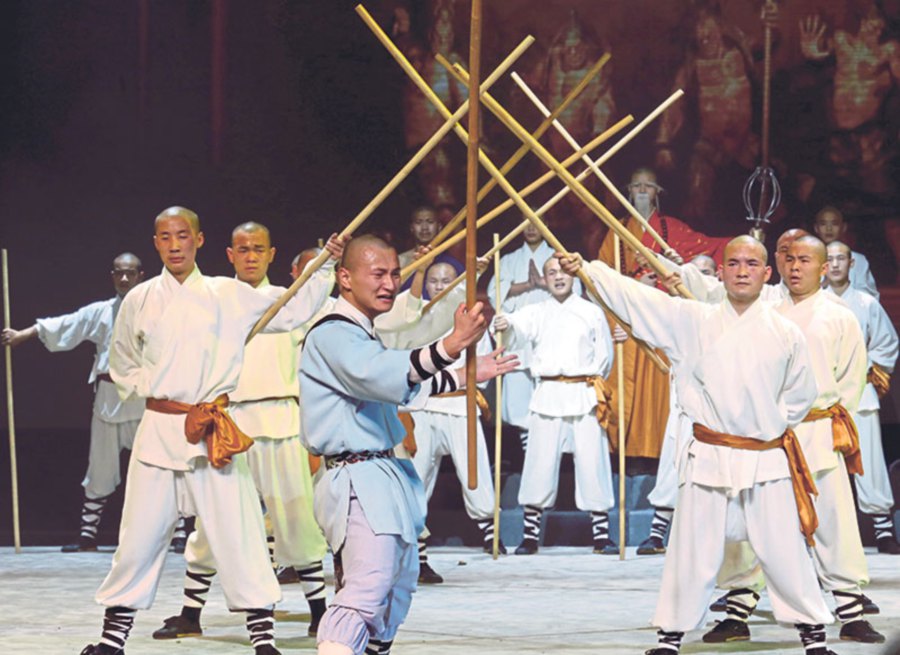 Brandishing staffs, one of the major weapons used in Chinese martial arts.