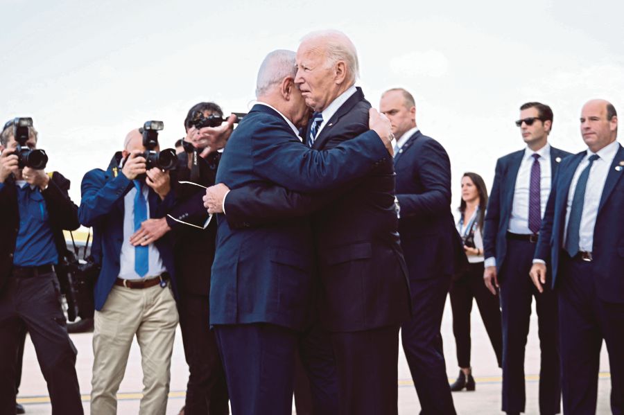 United States President Joe Biden hugging Israel Prime Minister Benjamin Netanyahu at Tel Aviv’s Ben Gurion Airport on Wednesday The two find themselves in an uneasy alliance that could be tested by an Israeli ground offensive of Gaza. AFP PIC 