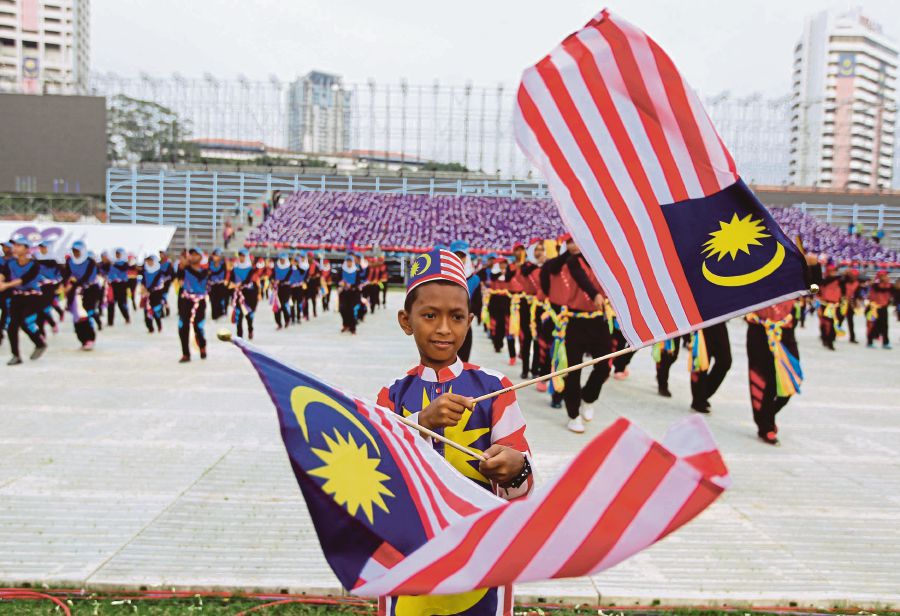 A boy practising during a rehearsal for the Merdeka parade in Kuala Lumpur last year. FILE PIC