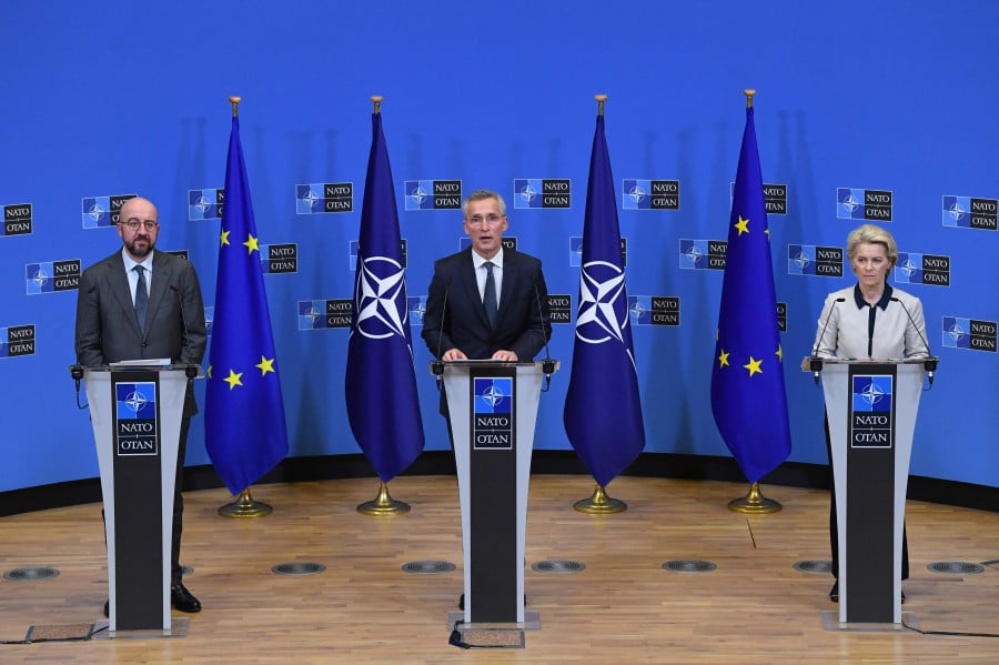 (From left) President of the European Council Charles Michel, NATO Secretary General Jens Stoltenberg and European Commission President Ursula von der Leyen give a press conference on Russia's military operation in Ukraine, at NATO headquarters in Brussels on February 24, 2022. -AFP PIC