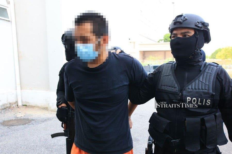 The suspected gunman of the April 14 Kuala Lumpur International Airport (KLIA) shooting has arrived at the Kota Baru Court Complex this morning to answer to seven charges under Section 8 of the Firearms (Increased Penalties) Act 1971 and Section 8(a) of the Arms Act 1960. NSTP/NIK ABDULLAH NIK OMAR 