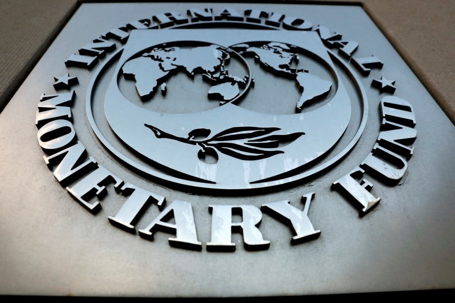 (FILE PHOTO) The International Monetary Fund (IMF) logo is seen outside the headquarters building in Washington, US. -REUTERS/Yuri Gripas