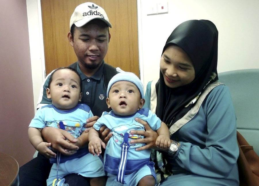 The parents of an eight-month-old baby boy, suffering from Ventricular Septal Defect​ (VSC), are seeking donations from the public for their son’s operation. (Pix by ZUHAINY ZULKIFFLI)