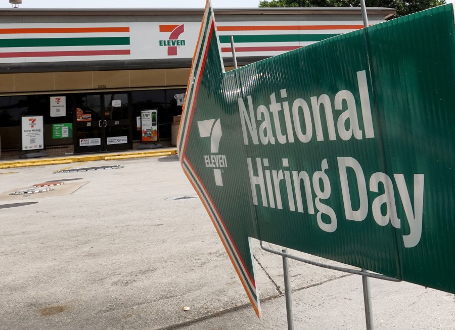 A 'now hiring' sign is seen outside of a business in Miami, Florida. AFP PIC