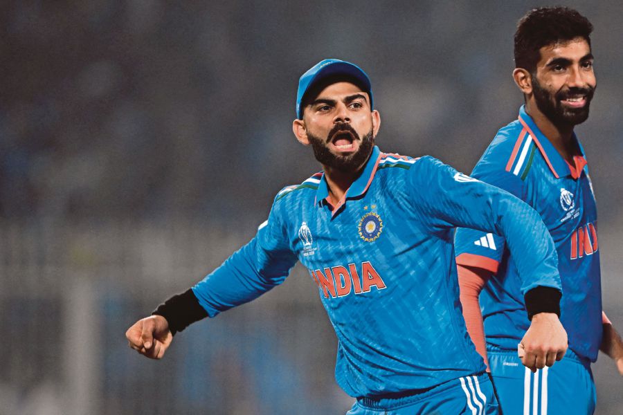 India's Virat Kohli (L) celebrates with Jasprit Bumrah after the dismissal of South Africa's Rassie van der Dussen during the 2023 ICC Men's Cricket World Cup one-day international (ODI) match between India and South Africa at the Eden Gardens in Kolkata on November 5, 2023. AFP FILE PIC