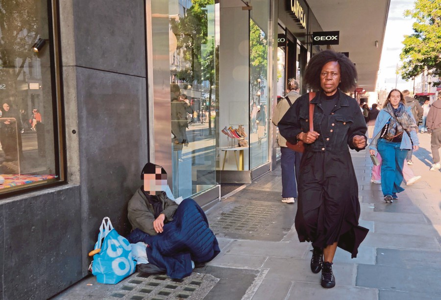 A homeless person settling down on the pavement along Oxford Street. The transformation of Oxford Street is not just because of the homeless, but can be attributed to a host of different issues, exacerbated by the pandemic lockdown. PIX BY ZAHARAH OTHMAN