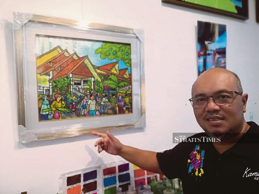 Kamal Dollah’s batik painting depicting the Geylang Serai Market and Food Centre is incorporated in Singapore Deputy Prime Minister Lawrence Wong’s Hari Raya greeting card this year. 