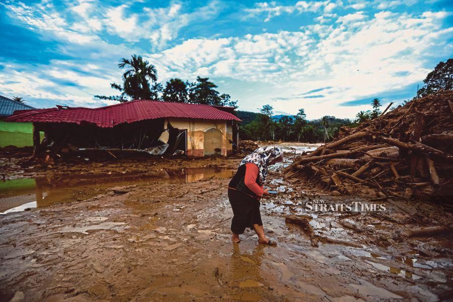 The aftermath of a massive flood in Kampung Iboi, Baling, Kedah, in July. As natural disasters become more frequent, more people are getting more educated on sustainability issues. -FILE PIC