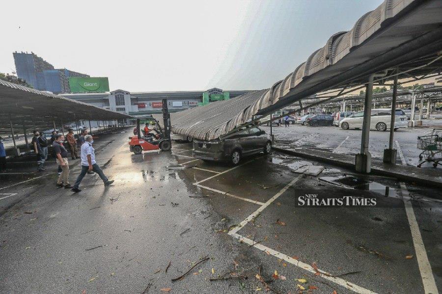 Ten vehicles were destroyed after a thunderstorm and strong winds wreaked havoc in Seksyen 13 here this afternoon. -NSTP/OWEE AH CHUN