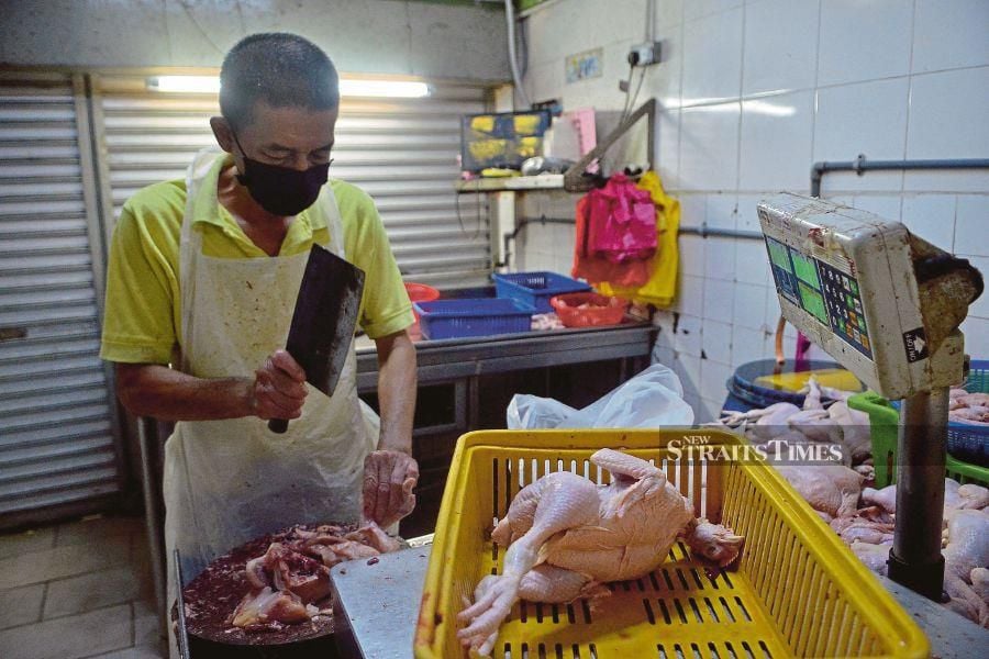 This  chicken trader in Klang had to close early  on Monday due to low stock. -NSTP/FAIZ ANUAR
