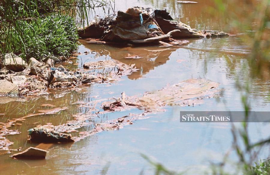 Garbage and pollutants in Sungai Gong. The improper disposal of non-sewage waste is an offence under Section 61 of the Water Services Industry Act 2006. -- Pix: NSTP/ FATHIL ASRI 