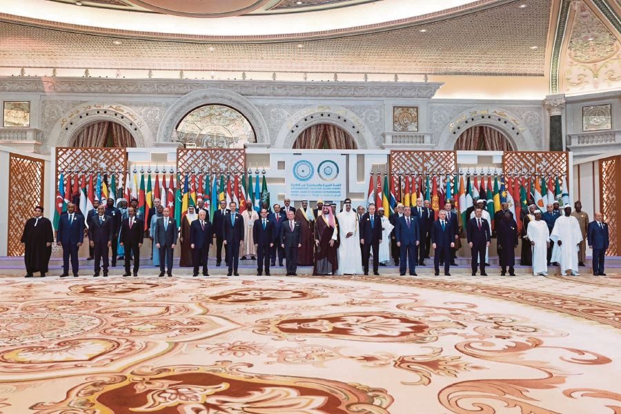  Prime Minister Datuk Seri Anwar Ibrahim (second row, centre) with other leaders of Arab and Islamic countries at the Extraordinary Summit of the Arab-Islamic States in Riyadh, Saudi Arabia on Nov 11. - PIC CREDIT: FB/ anwaribrahimofficial