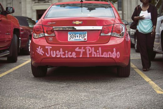 A car with ‘#Justice4Philando’ written on the bumper parked outside the funeral of Philando Castile in St Paul, Minnesota, on July 14. The live video of his dying moment has been seared into the minds of many. AFP pic