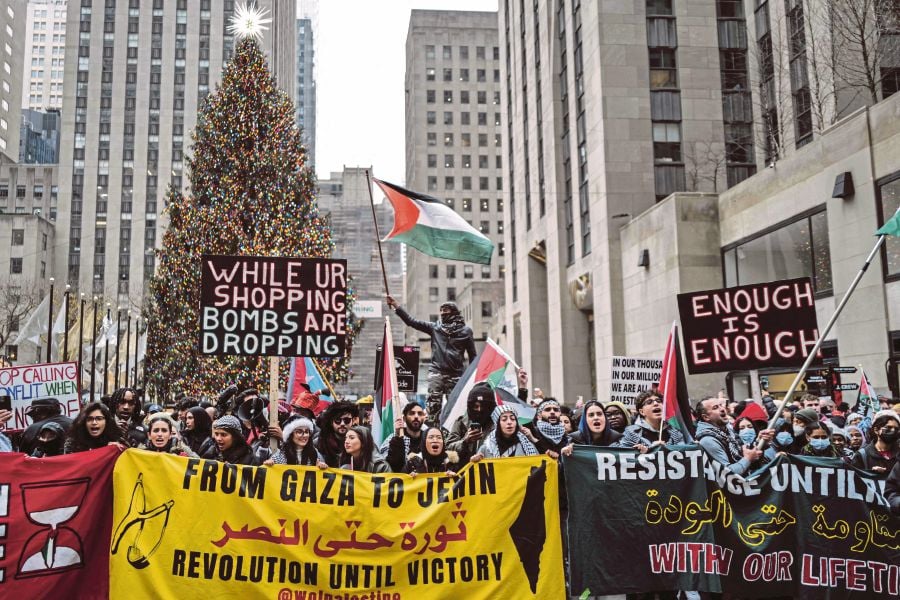 Demonstrators protesting in support of Palestinians in New York on Monday. A survey of six Arab publics last month showed that just seven per cent believed the United States played a positive role in the war in Gaza. AFP PIC