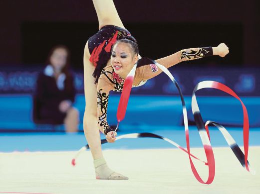 GLASGOW: Gold was unreachable but Wong Poh San still walked tall at the SSE Hydro in Glasgow today as she won the ribbon silver and hoop bronze to end her Commonwealth Games rhythmic gymnastics campaign. Pix by ROSLI AHMAD