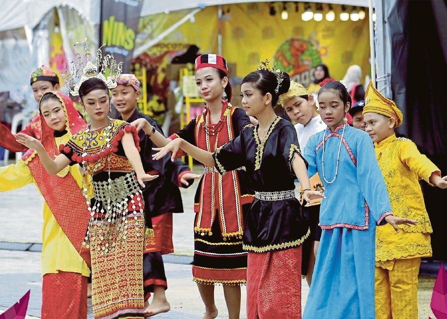 Performers in colourful attire swaying to a traditional Sarawak tune.