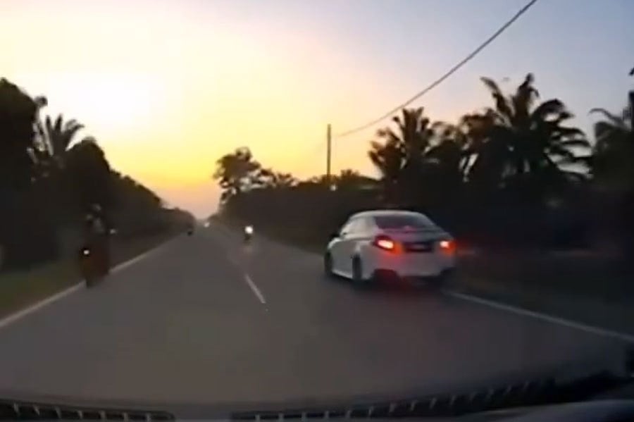 An eight-second dashcam footage of the crash showed the motorcyclist being flung almost 3m high following impact. PIC SCREEN CAPTURED FROM FB VIDEO