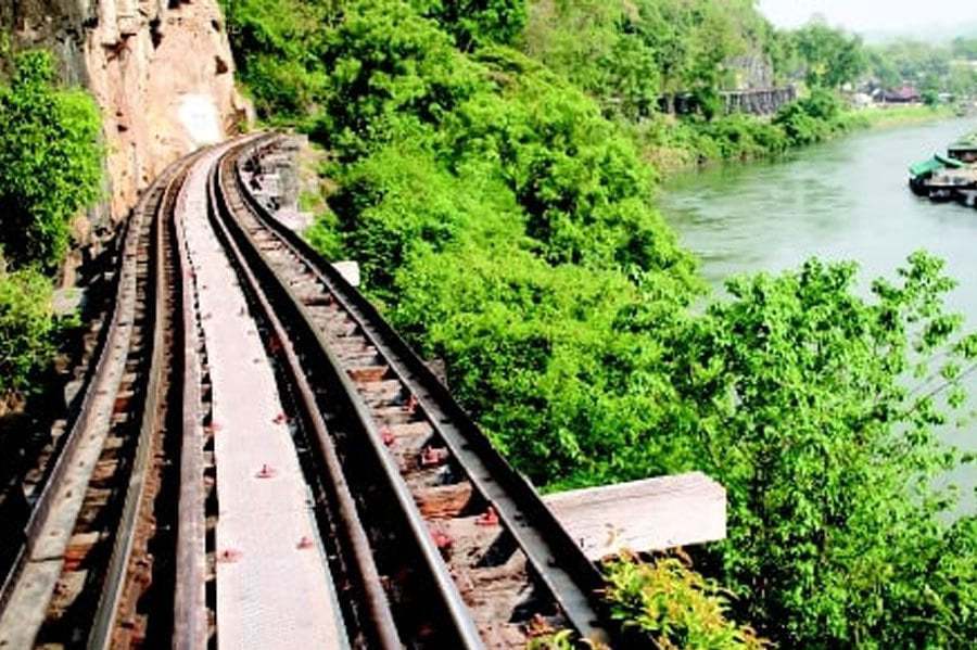 As the train chugs through the Tham Krasae wooden trestle bridge, visitors click away on their cameras and mobile phones, capturing one of the most scenic highlights of the infamous “Death Railway” between Thailand and Myanmar. - FILE PIC