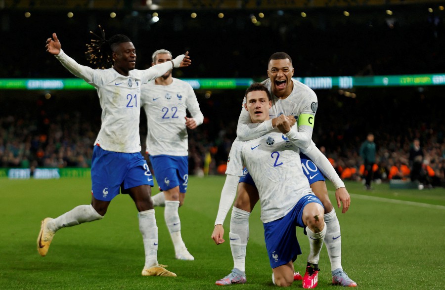 France's Benjamin Pavard celebrates scoring their first goal with Kylian Mbappe, Eduardo Camavinga and Theo Hernandez. -REUTERS PIC