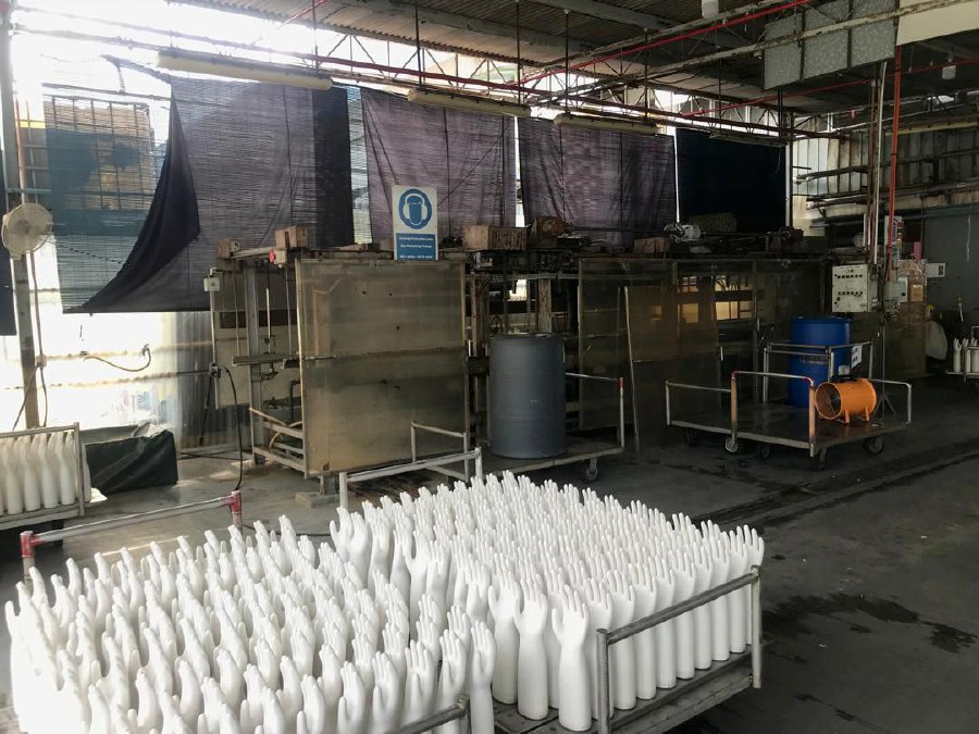 A worker at a rubber glove production factory fainted, while 16 others complained of eye irritation and nausea following a chemical spill at the premises in Bakar Arang near here yesterday. PIC COURTESY OF FIRE & RESCUE DEPT