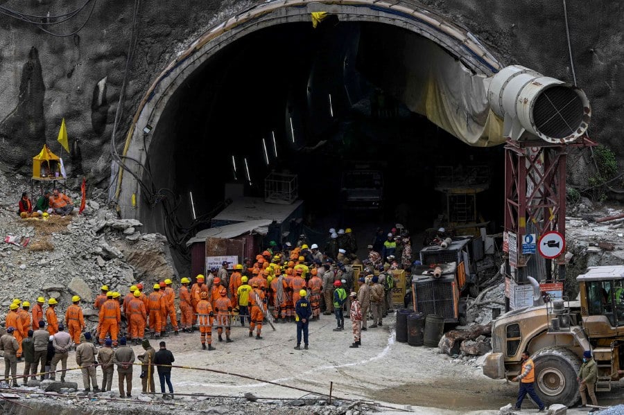 National Disaster Response Force personnel along with other rescue operatives gathering near the Silkyara tunnel, which is under construction, in the Uttarkashi district of India's Uttarakhand state, on Nov 28, 2023. AFP PIC