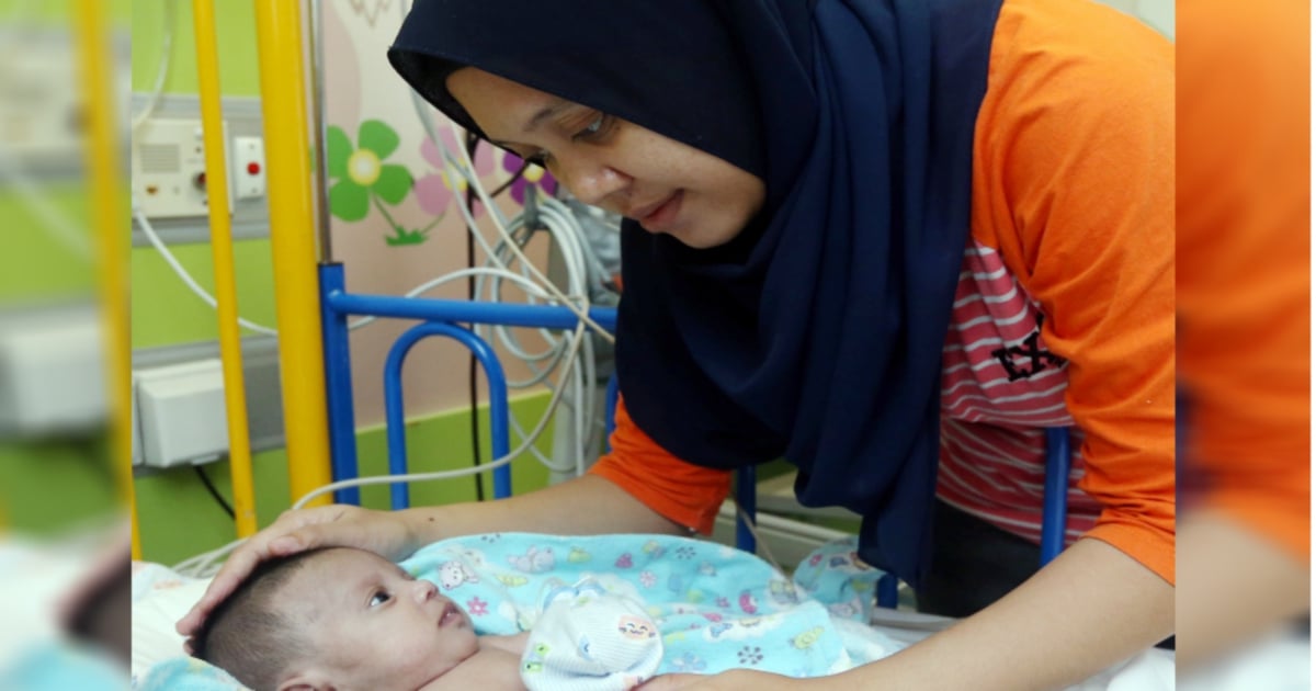 Parents desperate to raise RM40k for month-old baby's heart surgery ...