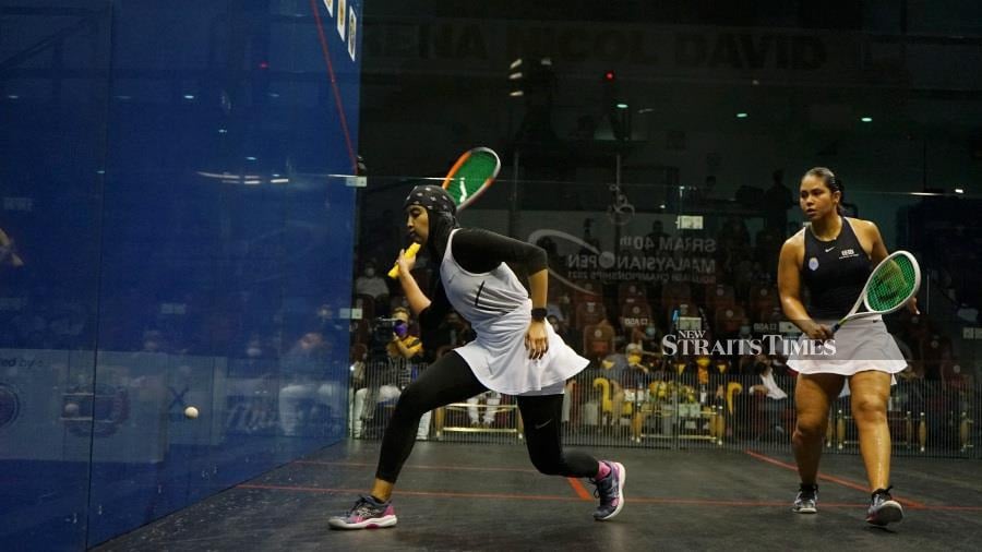 Aifa Azman (left) in action against Salma Hany in the final of the Malaysian Open yesterday. -NSTP/KNG ZHENG GUAN