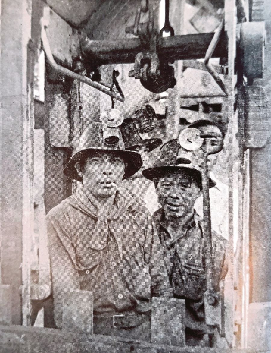 Workers about to descend into the mine. 