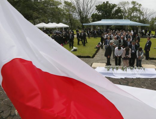 Relatives of Japanese Imperial Forces who died in the Philippines during WWII offer white carnation flowers at the Japanese Memorial Garden, a Japanese war memorial, after visiting Japan's Emperor Akihito and Empress Michiko paid homage in ceremony at Cavinti township, Laguna province southeast of Manila, Philippines Friday, Jan. 29, 2016. AP Photo 