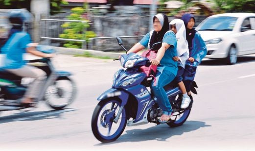 Ignoring motorcycle helmet law | New Straits Times | Malaysia General