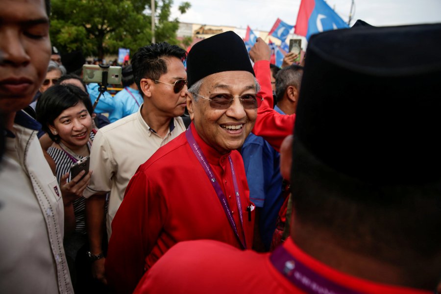  Former prime minister Tun Dr Mahathir Mohamad(C) reacts while he arrives to submit his election nomination for the upcoming 14th general elections in the island of Langkawi, Malaysia, 28 April 2018. Mahathir will be contesting against incumbent Datuk Ir Nawawi Ahmad in Langkawi in the 09 May general election. EPA-EFE 