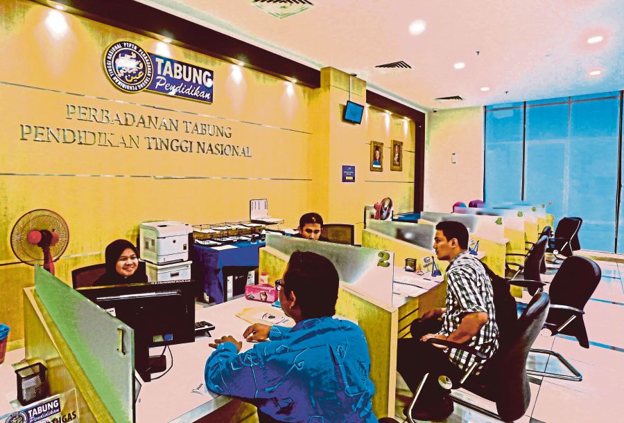 Workers attending to customers at a National Higher Education Fund Corporation branch in Kuala Lumpur. -NSTP file pic