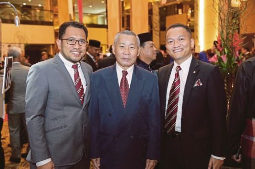 Old boys scramble to take pictures with Tan Gim Hoe (centre) on Saturday. Chinese teachers made up almost 80 per cent of the teaching staff at the Malay College Kuala Kangsar — an all-male, all-Malay residential school — in the 1960s and 1970s. Most have come to be remembered for their commitment till this day.