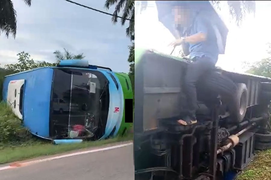 The driver and guide of a tour bus escaped uninjured when the vehicle skidded and landed on its side along Jalan Kluang-Mersing. PIC SCREEN CAPTURED FROM SOCMED