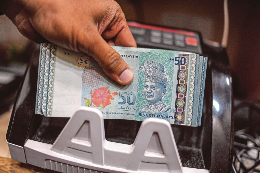 The government has no intention of pegging the ringgit and imposing foreign exchange (forex) controls as the country did during the Asian financial crisis in 1998, since it is not the right solution for dealing with current challenges. - AFP Pic
