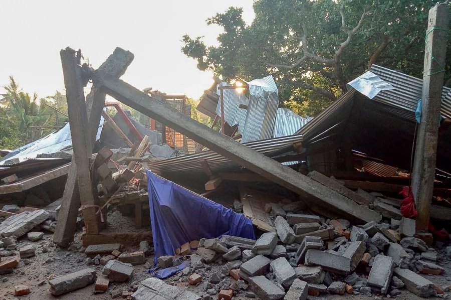 A handout photo made available by the Indonesian Search And Rescue Agency (SAR) shows a collapsed house after an earthquake struck in Lombok, West Nusa Tenggara, Indonesia. EPA