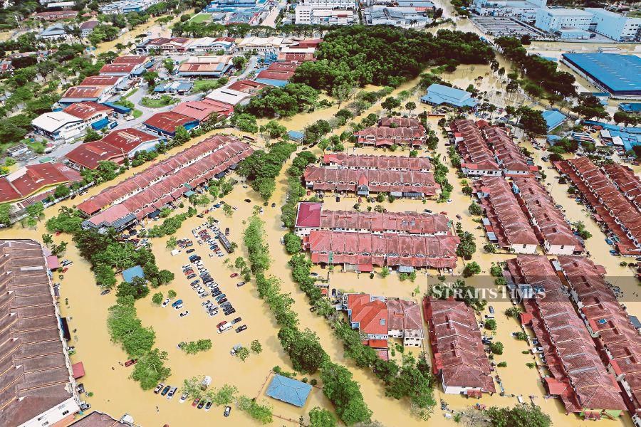 This December 19, 2021, shows an aerial view of the floods in Taman Sri Muda, Shah Alam. -NSTP/ASYRAF HAMZAH