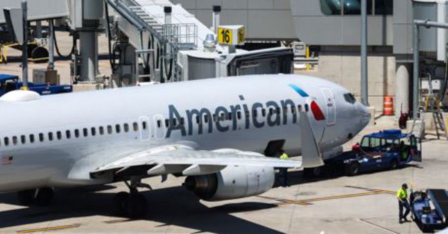 A passenger has been fined US$81,950 by the US Federal Aviation Administration (FAA) for kicking and spitting at flight attendants and passengers before attempting to open the cabin door on an American Airlines flight. — AFP FILE PIC