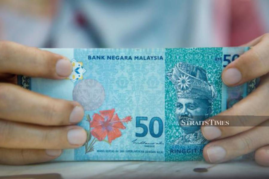 The ringgit opened lower against the US dollar on Tuesday as most traders are eagerly awaiting the first Bank Negara Malaysia’s Monetary Policy Committee (MPC) meeting of this year, scheduled for today and tomorrow.